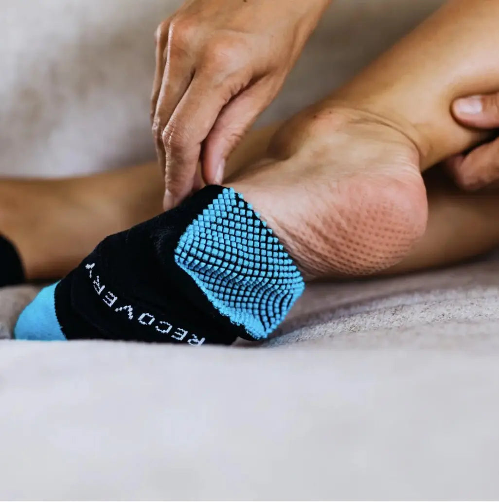 Blue and black Naboso Recovery Sock with textured recovery text
