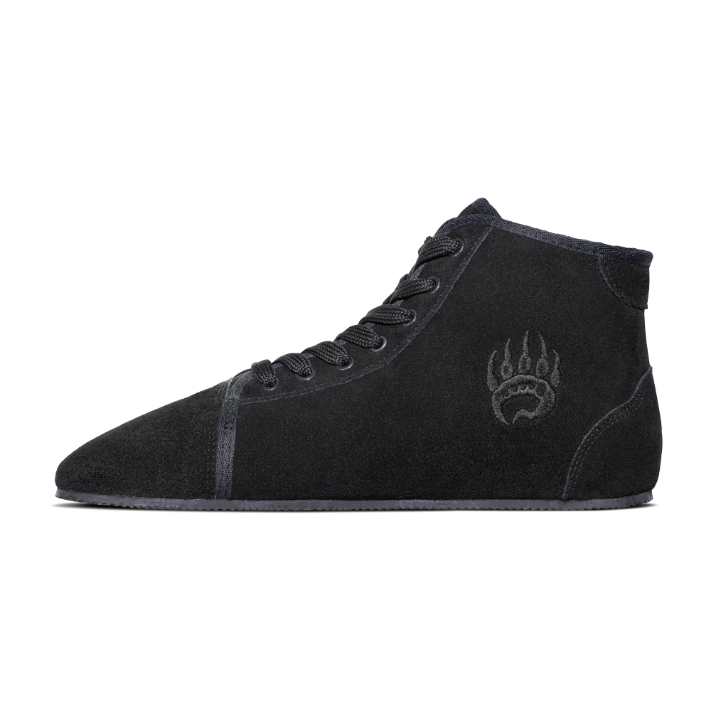 Side profile of the Bearfoot Ursus Suede High-Top, a training sneaker in charcoal black with laces and a unique, bear paw logo imprinted near the ankle area.