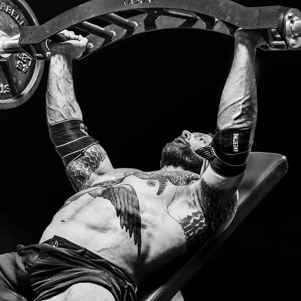 Black and silver A.W.E.some Wraps barbell with weight plates