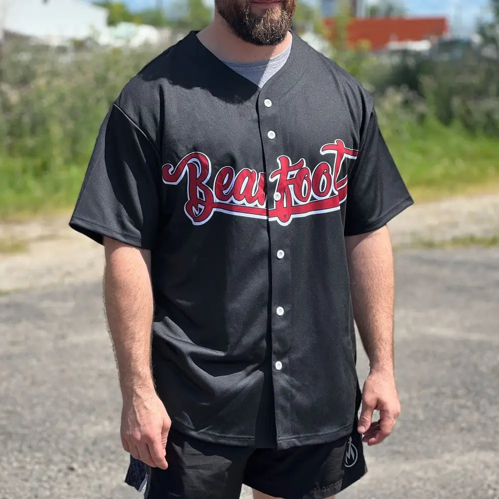 Black polyester baseball jersey with red white Beaufoot cursive chest lettering