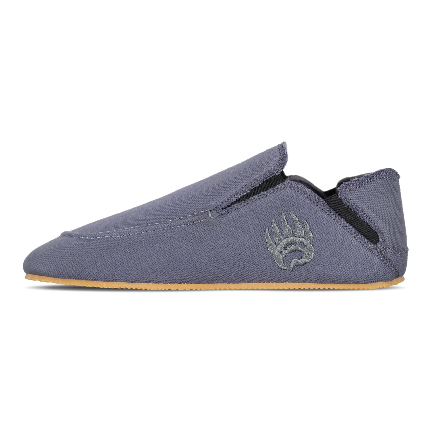 A single, gray Bearfoot Oso Canvas casual shoe featuring a slip-on design with a rubber sole and an embroidered bear paw logo on the upper side. The shoe has a stretchable band at the opening for better comfort.