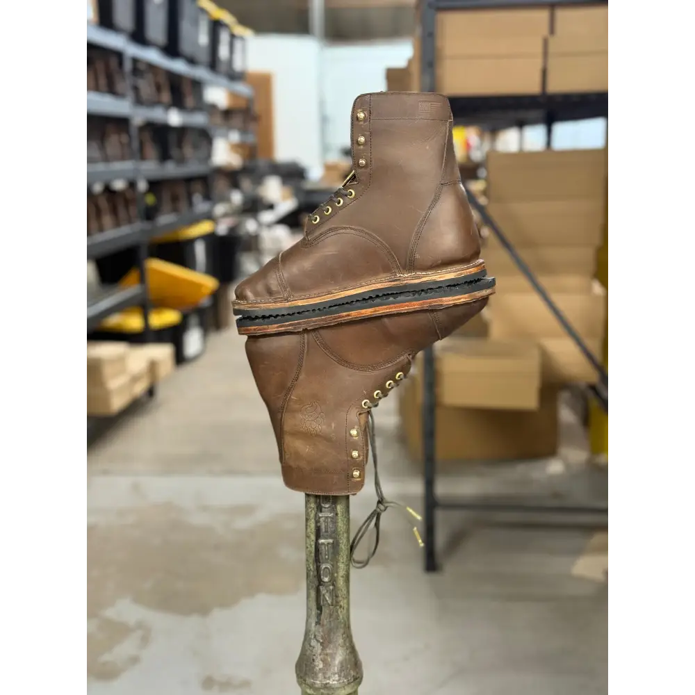 Brown leather work boot with brass eyelets, thick sole from Barely Used Footwear