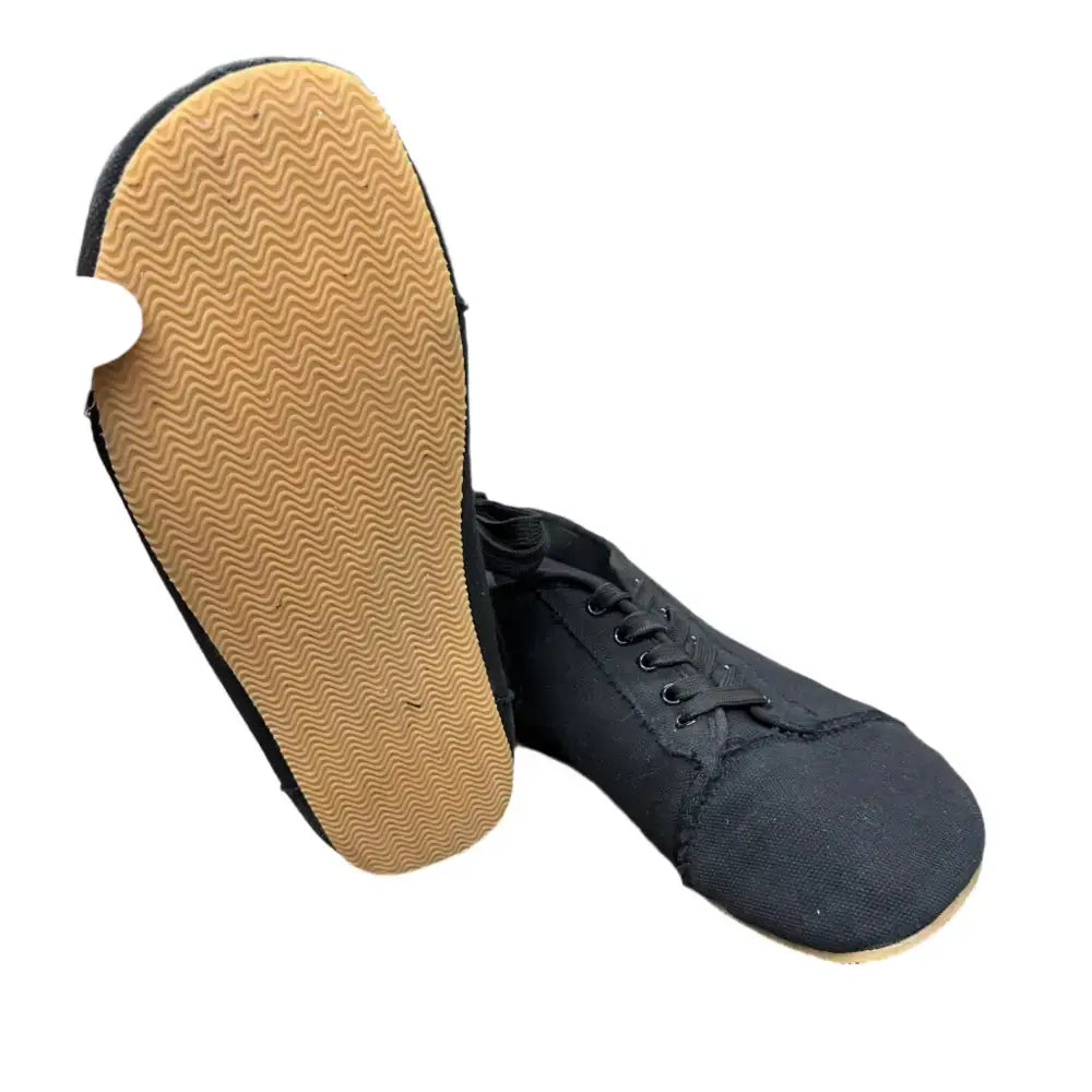Black canvas dance shoe with tan wavy sole from Barely Used Footwear