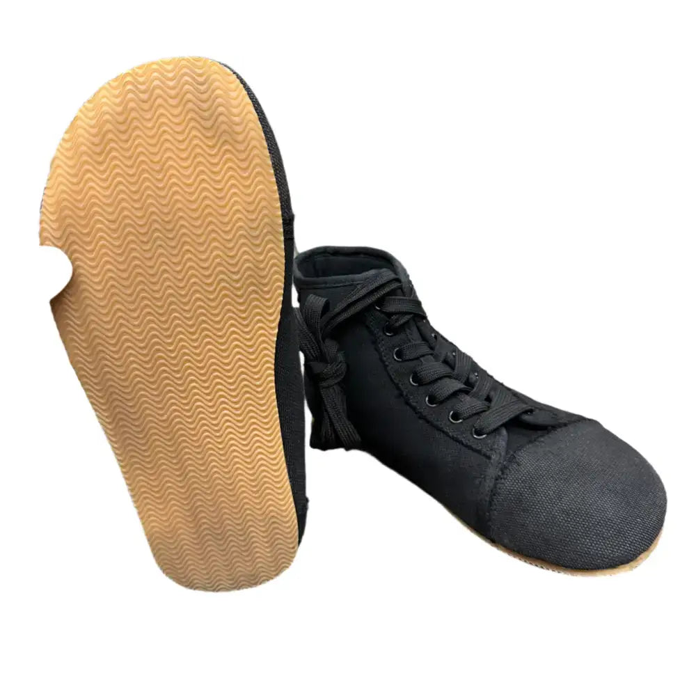 Bearly Used Footwear black high-top sneaker with tan wavy sole, minor imperfections