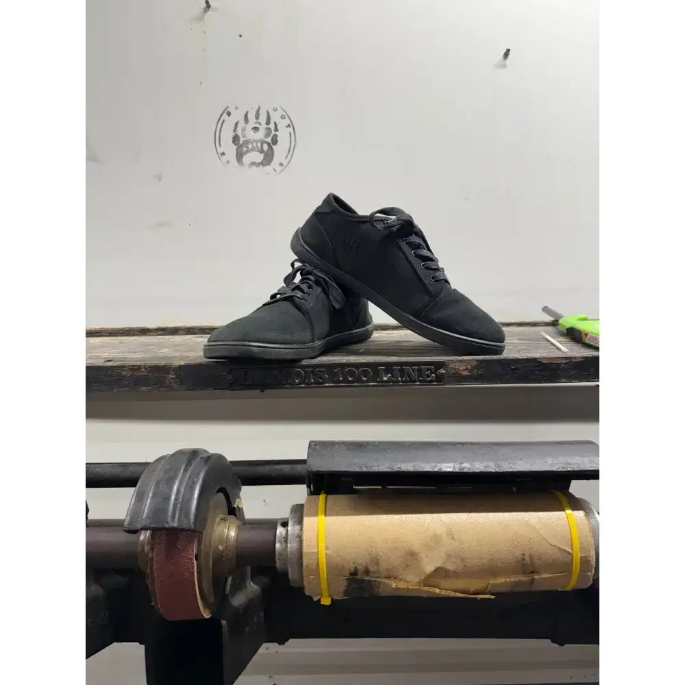 Black canvas sneakers with laces from Barely Used Footwear, minor imperfections