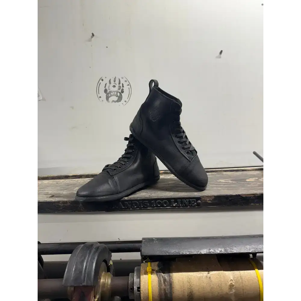 Black leather high-top boots with laces, minor imperfections from Bearly Used Footwear