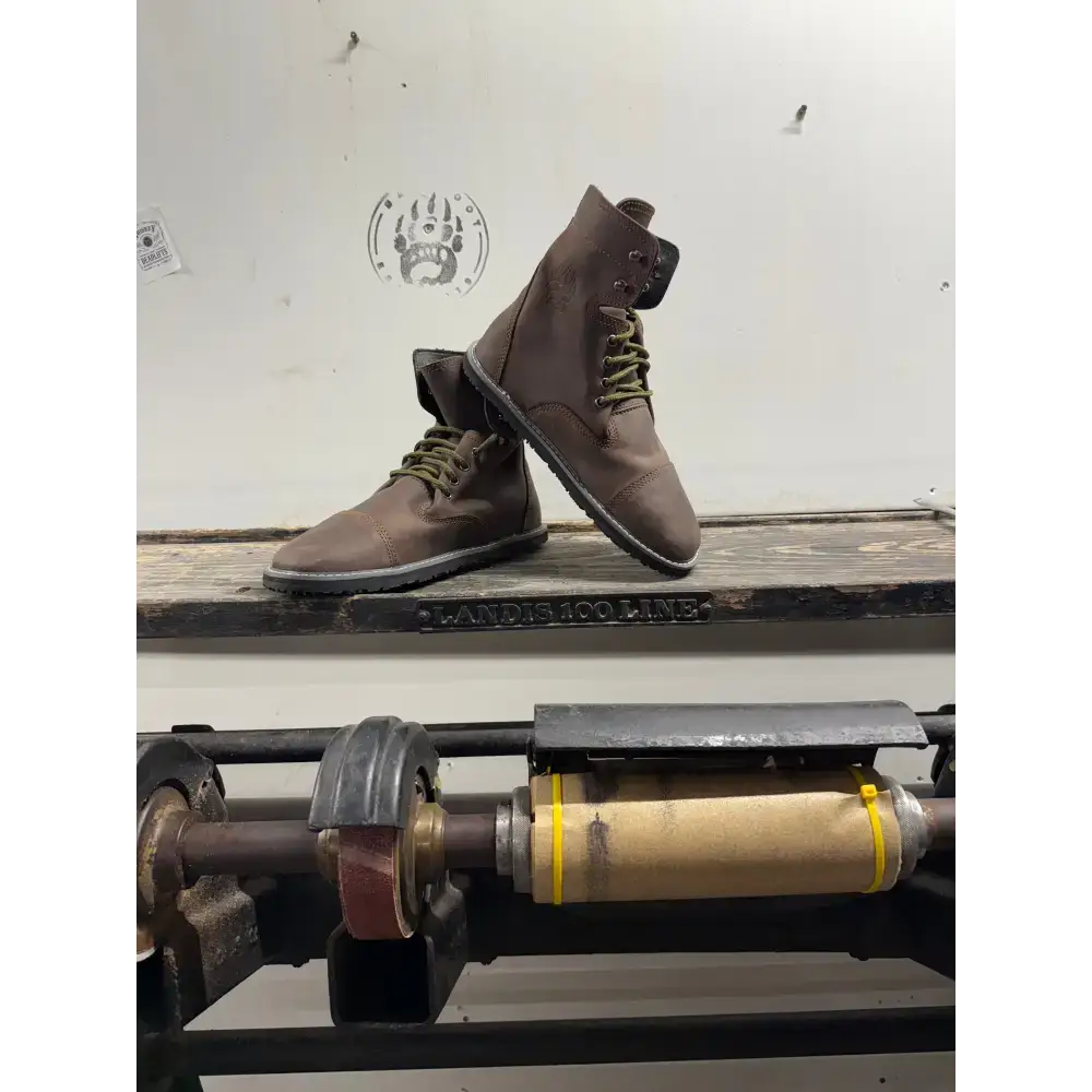 Brown leather lace-up boots with olive green laces from Barely Used Footwear