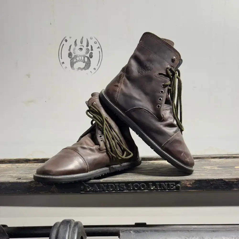 Brown leather combat boots with olive green laces from Barely Used Footwear