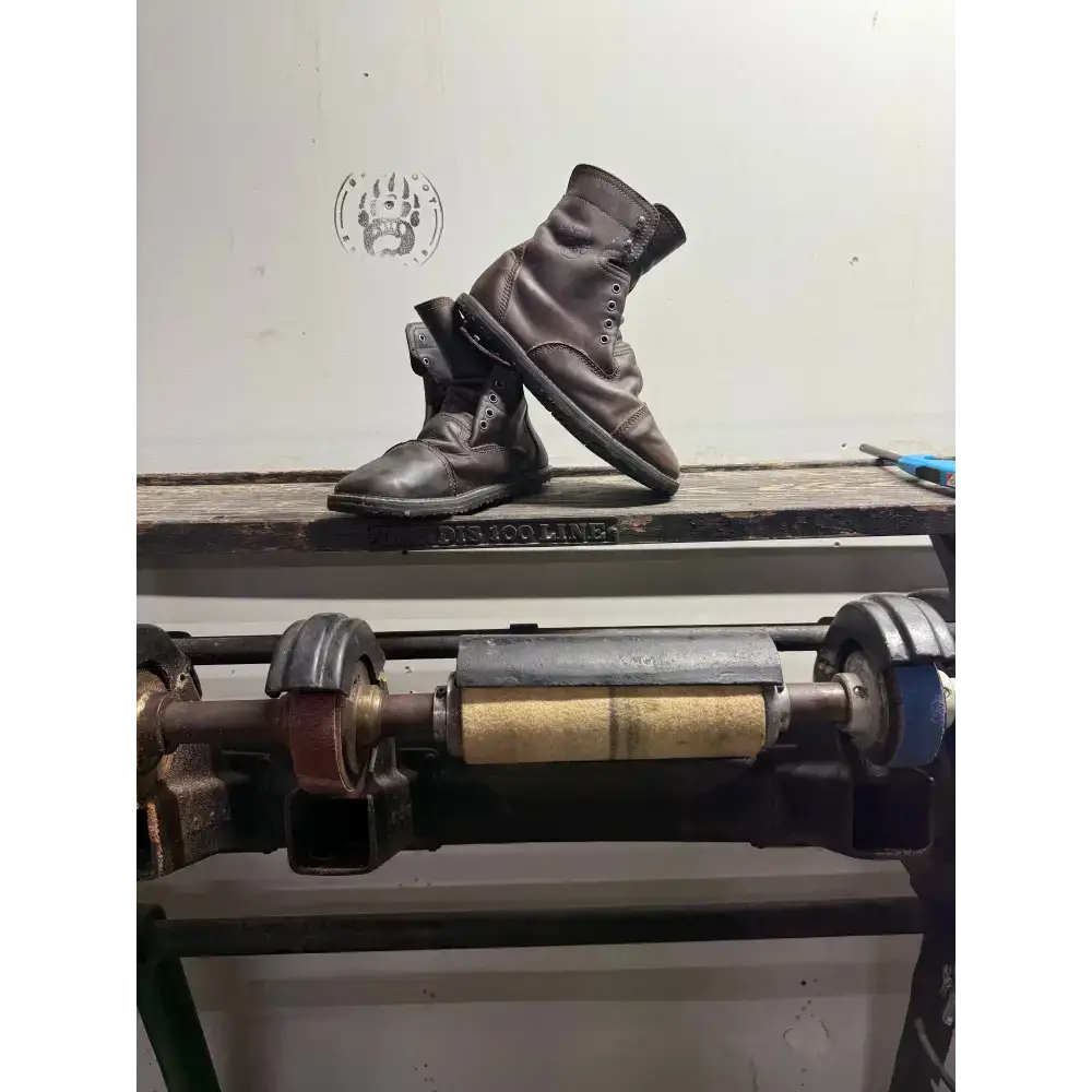 Dark brown leather work boots from Barely Used Footwear on wood