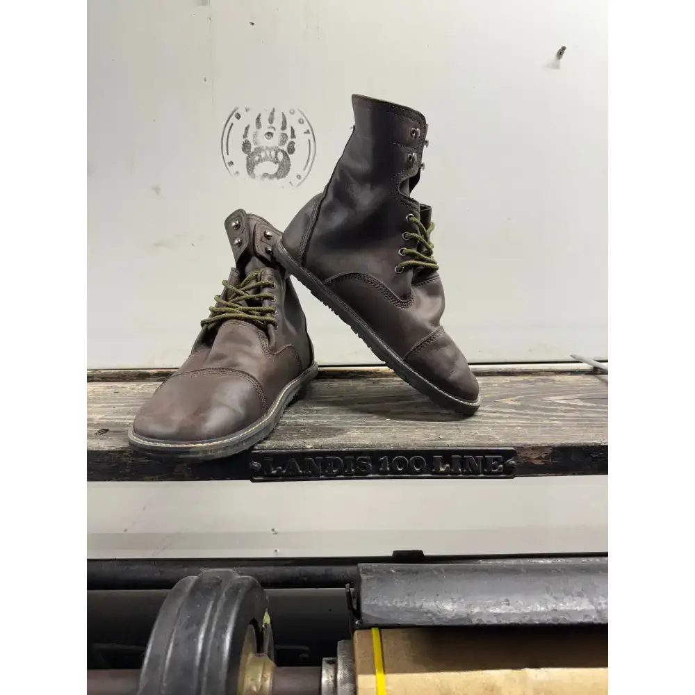 Dark brown leather work boots with green laces from Barely Used Footwear