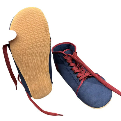 Navy blue canvas high-top sneakers with red laces, tan sole from Barely Used Footwear