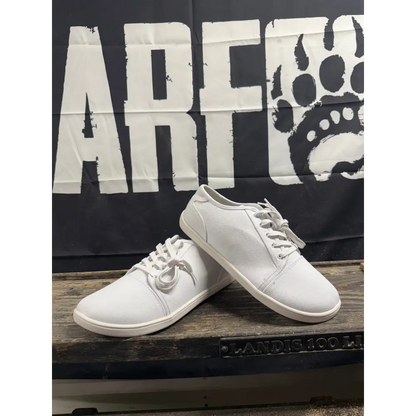 Bearly Used Footwear white canvas sneakers with minor imperfections