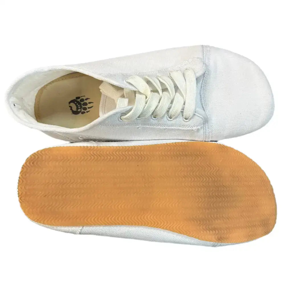 Bearly Used Footwear white canvas low-top sneaker with minor imperfections