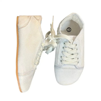 Bearly Used Footwear white canvas sneakers with minor imperfections