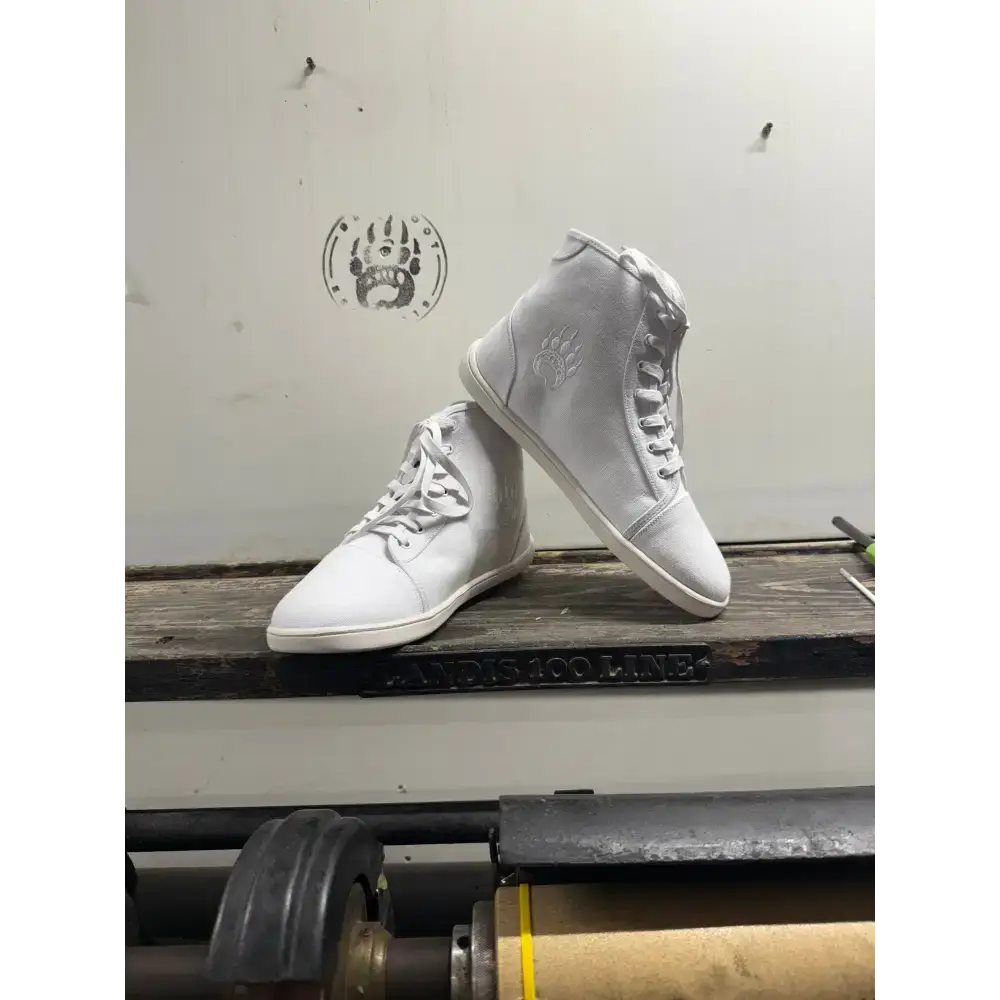 White high-top sneakers from Barely Used Footwear with minor imperfections
