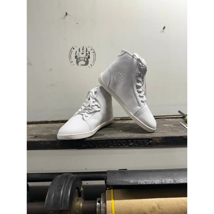White high-top sneakers from Barely Used Footwear with minor imperfections