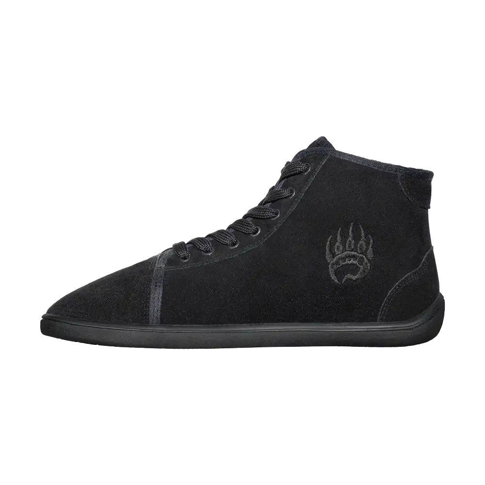 Black high-top sneaker with wolf design on side, suede material.