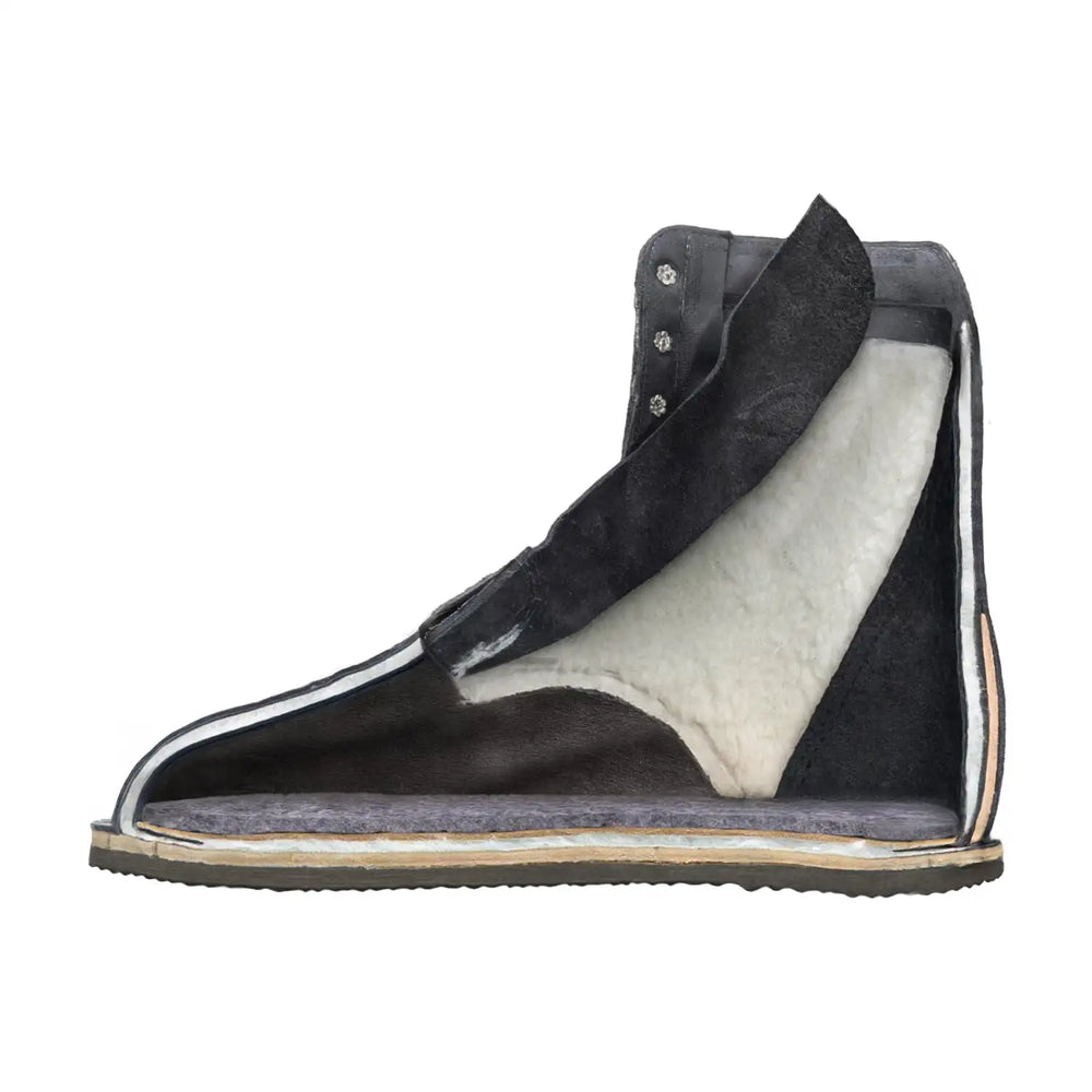 Black suede high-top boot with a plush white shearling lining and a gray rubber sole.