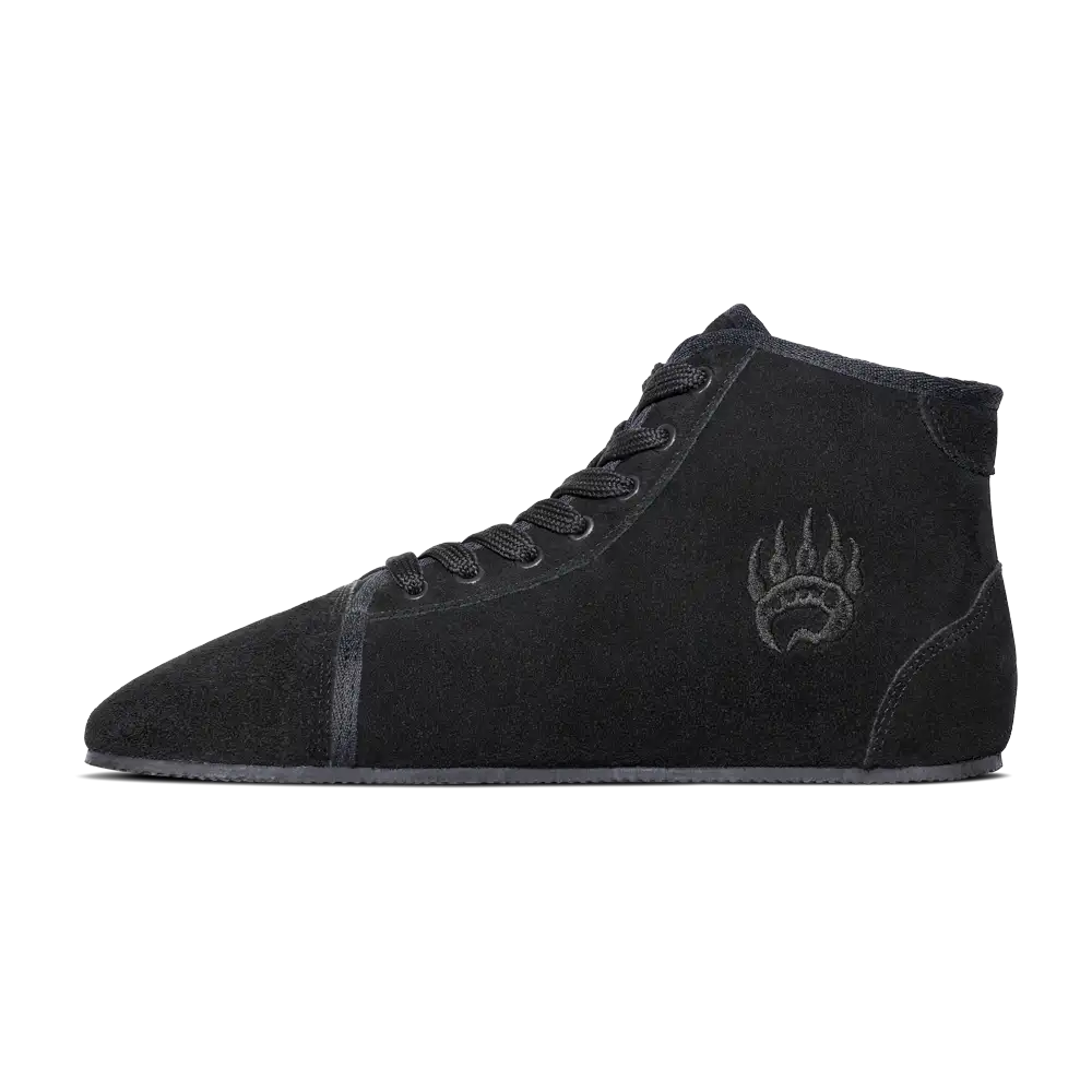 Black suede high-top sneaker with wolf paw print design on the side.