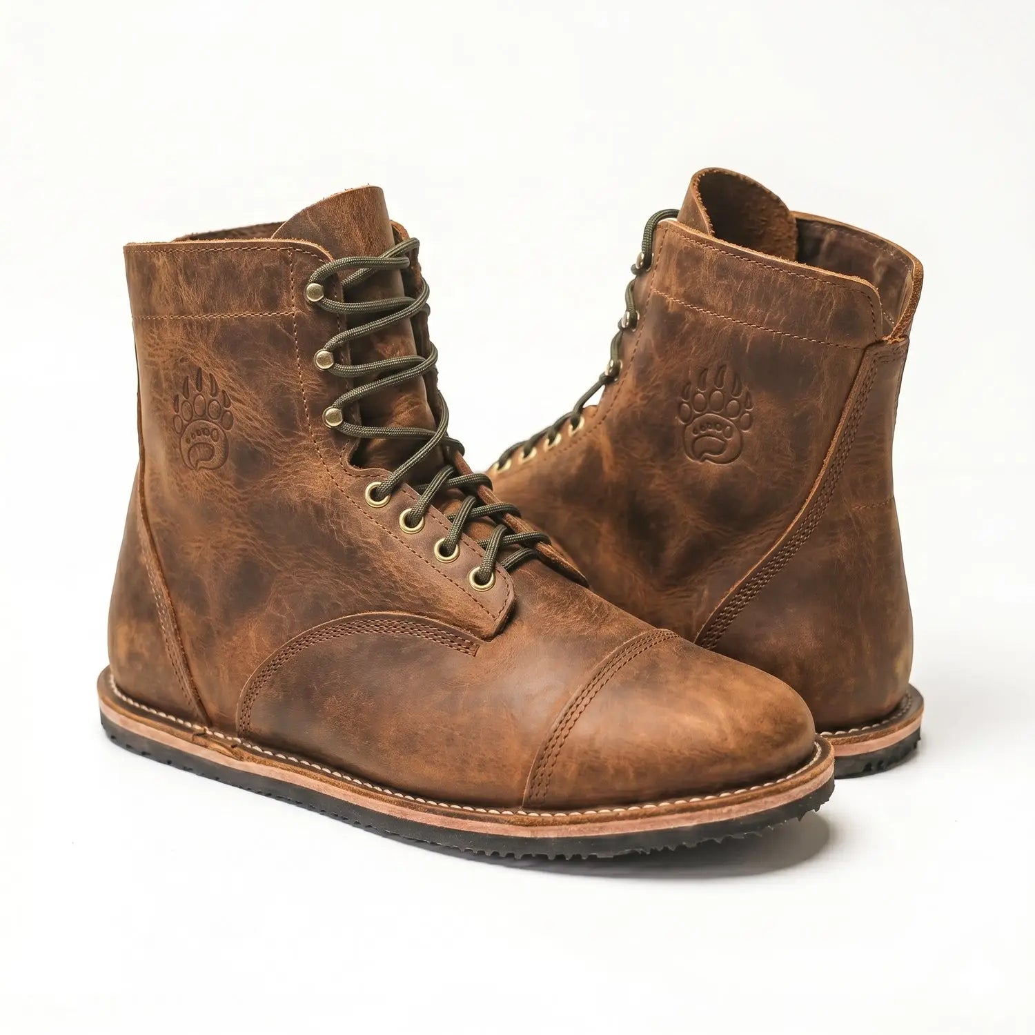 Brown leather lace-up bruin-patriot barefoot boot in cognac with embossed paw print and zero-drop sole design