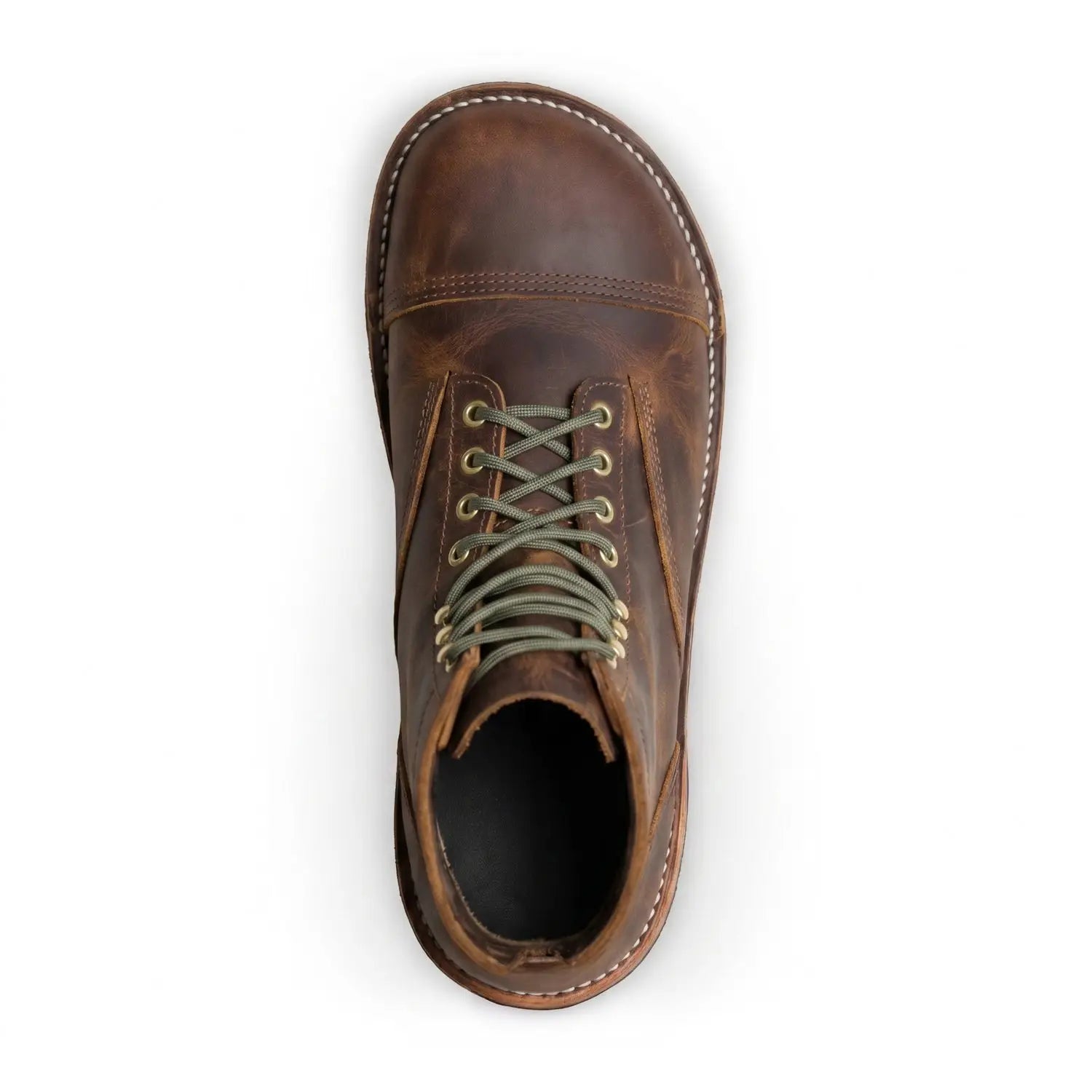A well-worn cognac bruin-patriot barefoot boot made of brown bison leather with olive green laces and brass eyelets
