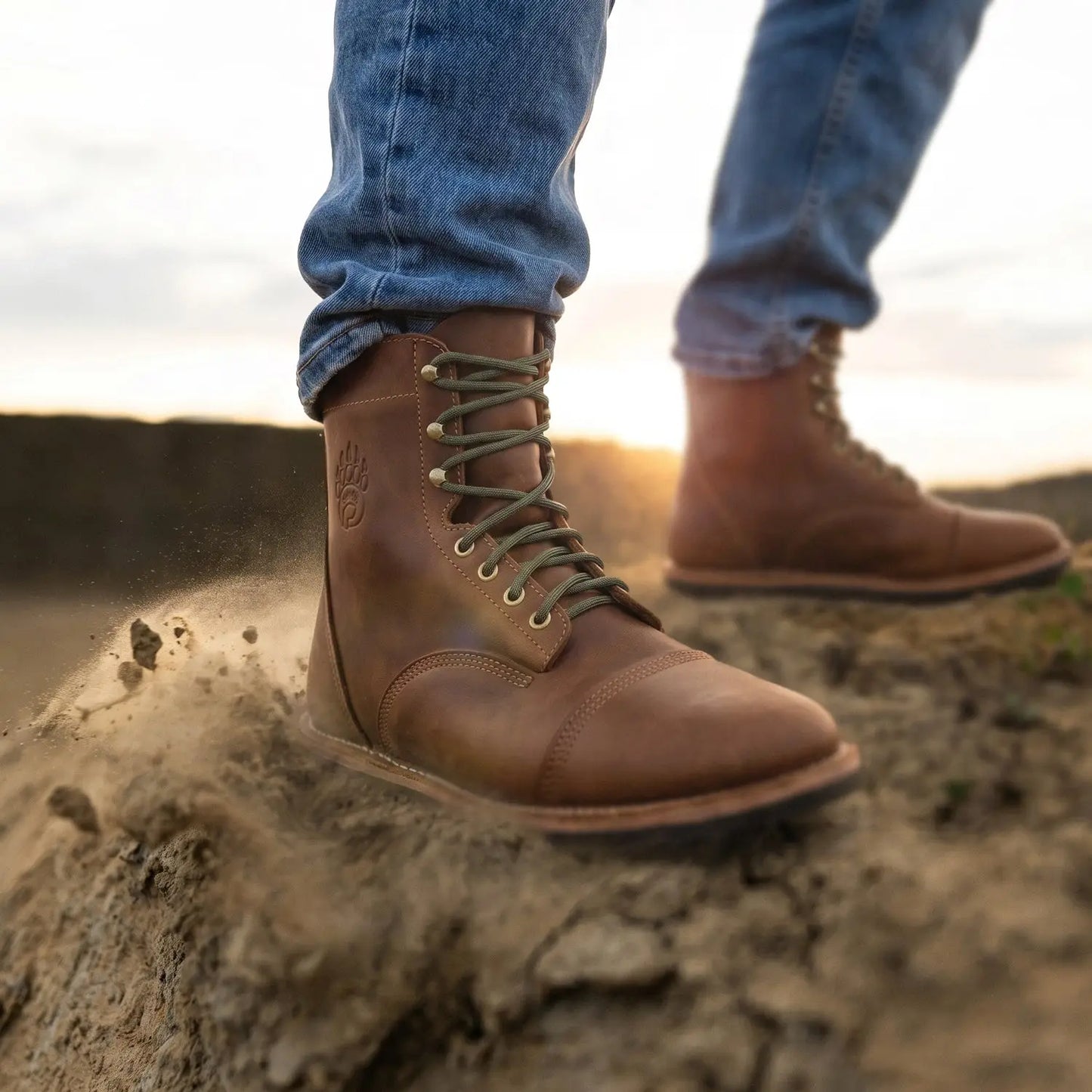 Brown leather rugged barefoot boot with olive laces and stitched cap toe made from crazy horse leather with zero drop sole