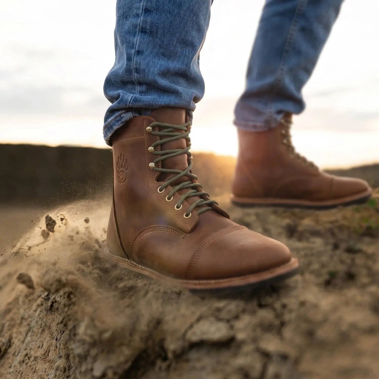 Brown leather rugged barefoot boot with olive laces and stitched cap toe made from crazy horse leather with zero drop sole
