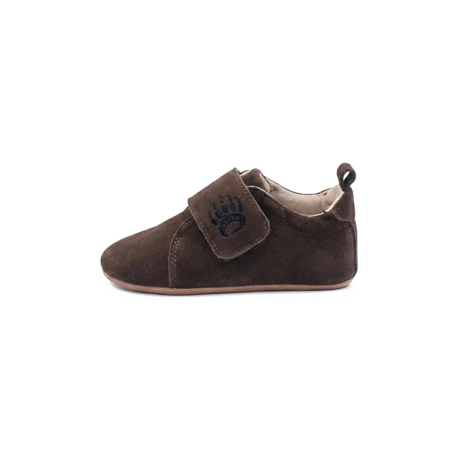 Brown suede baby shoe cub sv cocoa with velcro strap and dark blue paw print logo for toddler’s natural development