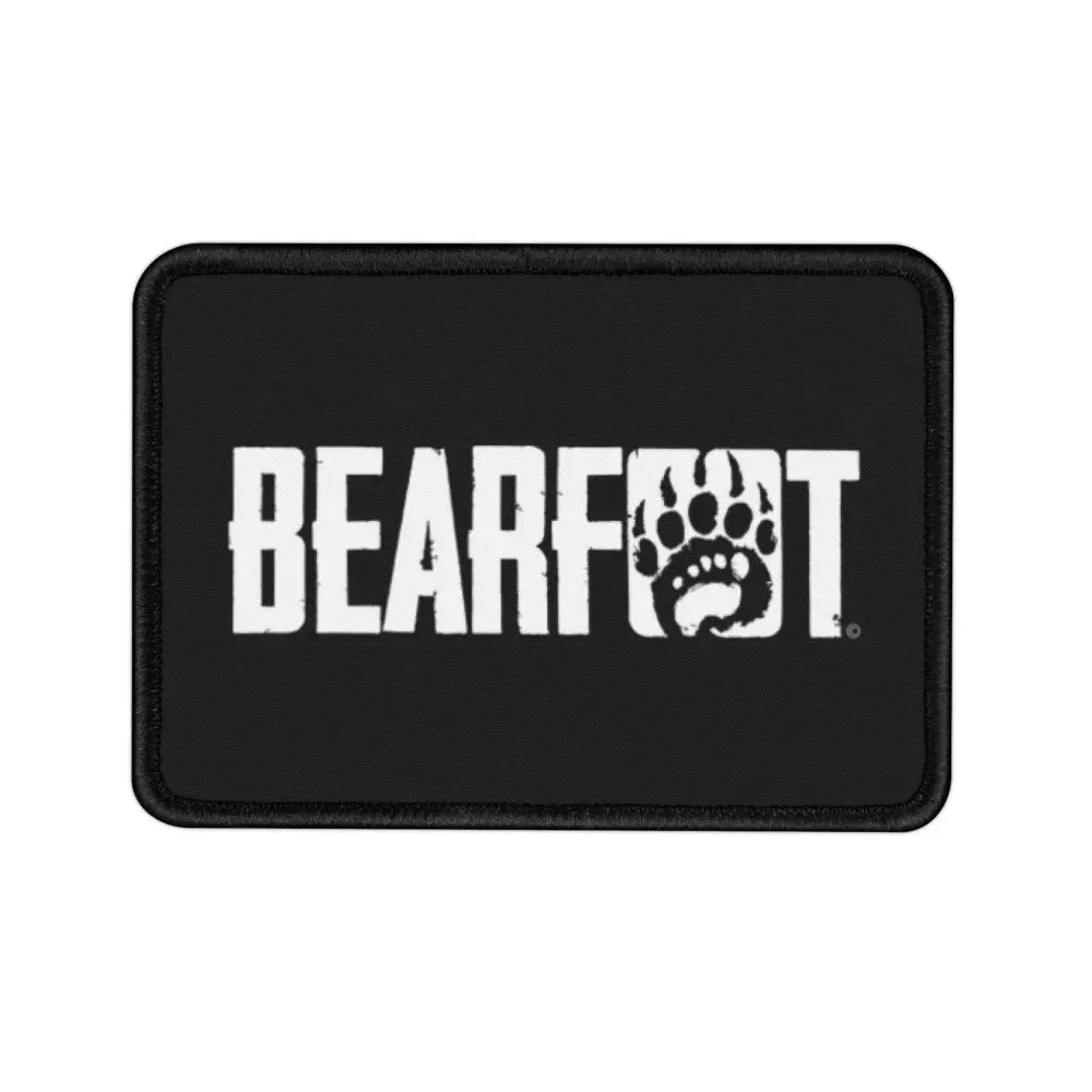 Bearfoot paw print iron-on patch on black background