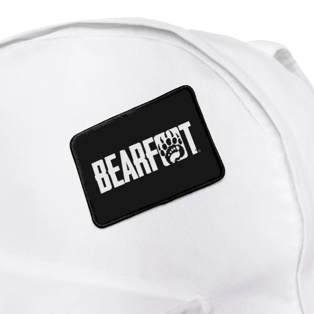 Bearfoot iron-on patch on white hat for personalized love adding
