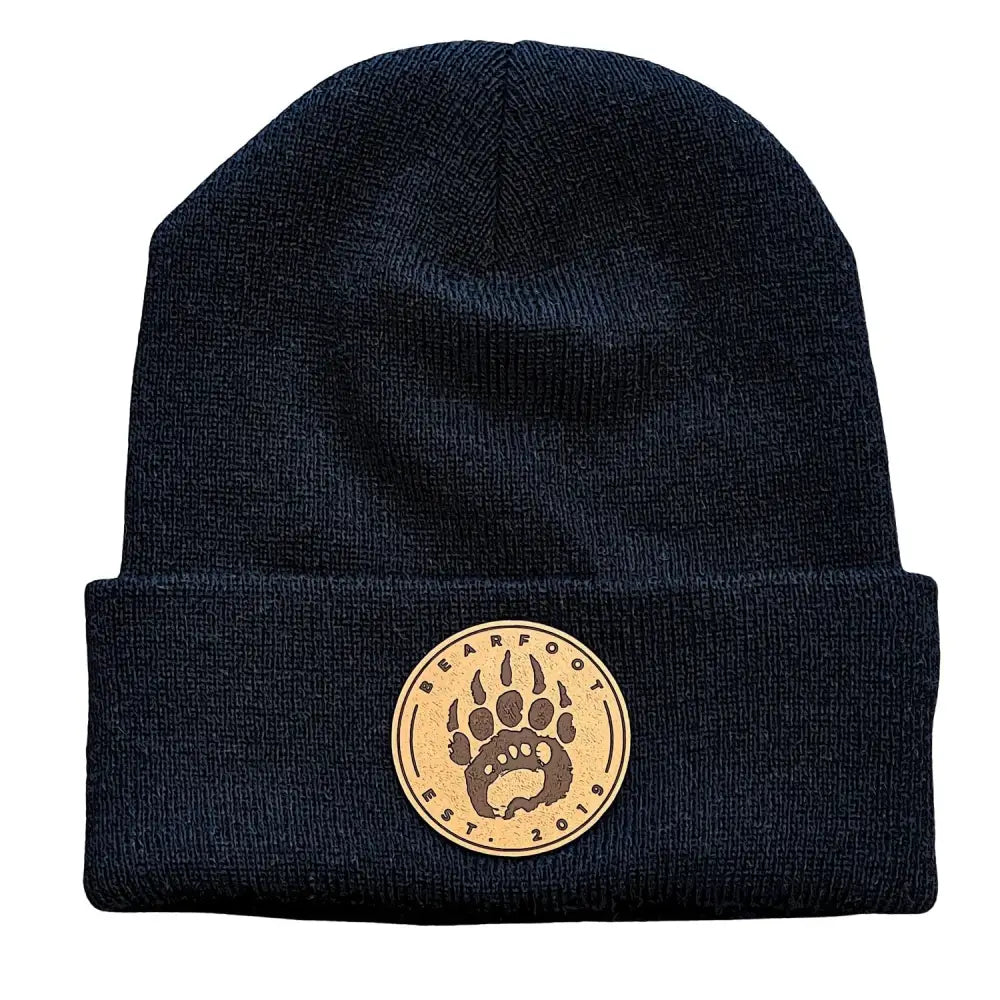 Black knit beanie with leather patch bear paw design and bearfoot text