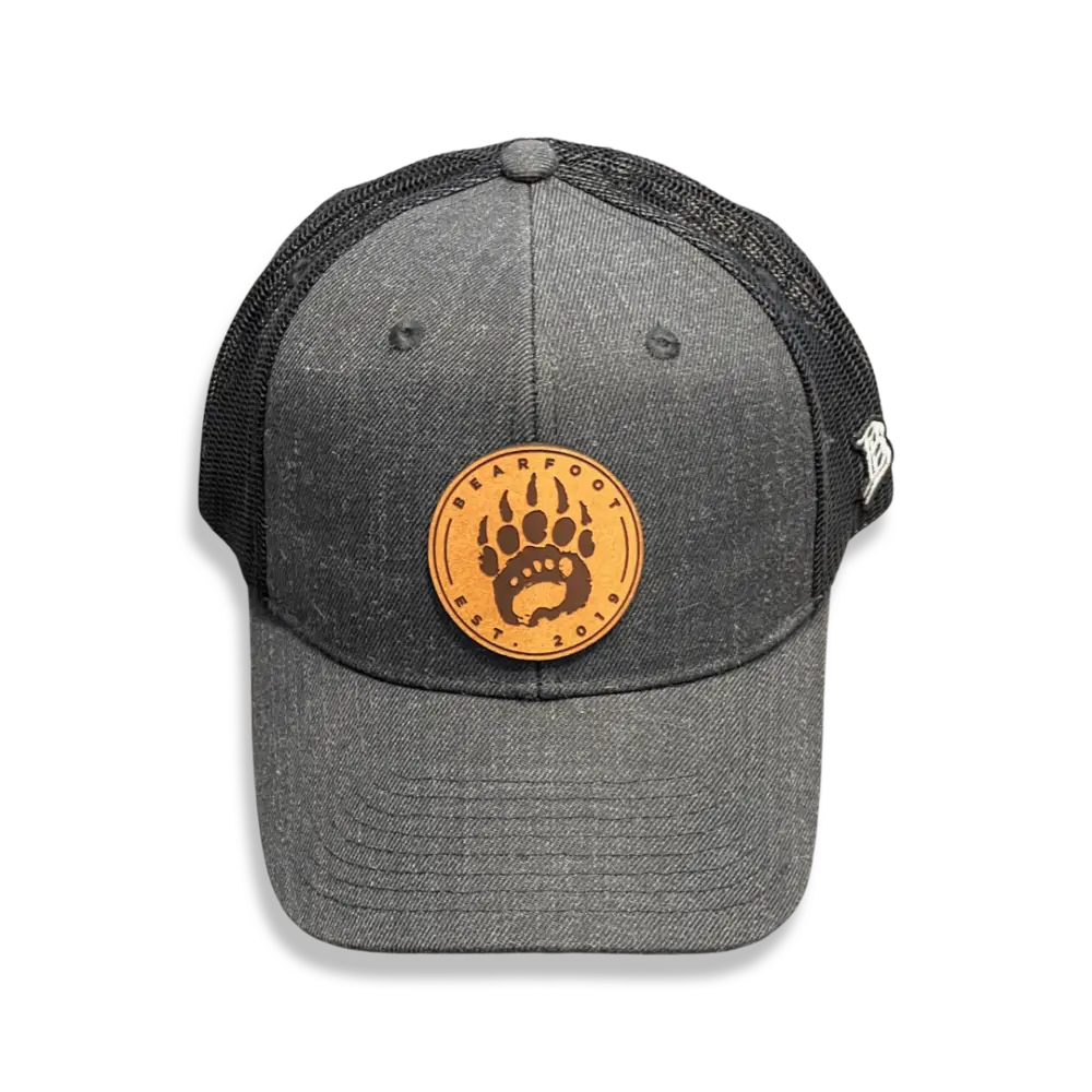 Charcoal gray leather patch trucker hat with bear paw print
