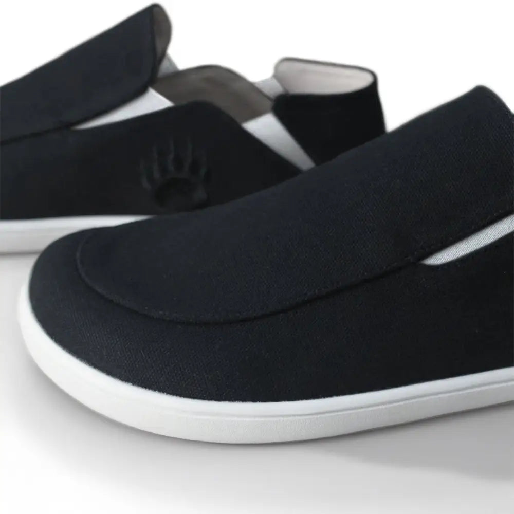 Oso CG2 black barefoot slip-on shoe with white sole and heel tab