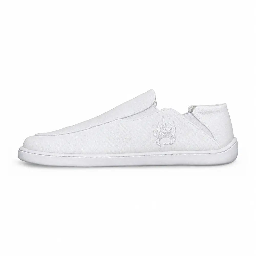 White canvas barefoot slip-on shoe oso cg2 with wide toe box and subtle embroidered paw print logo on the side