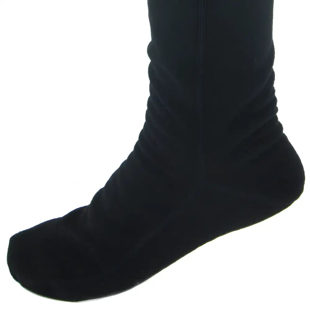 Black over-the-knee fleece socks with plush velvet ankle texture