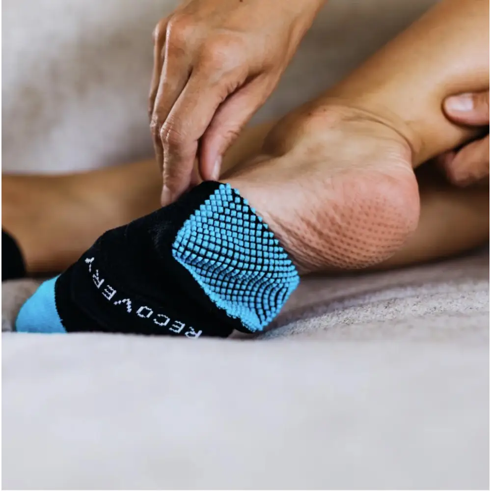 Black and blue textured Naboso recovery sock with recovery text