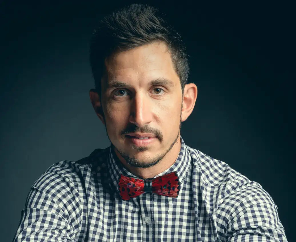Red and black checkered bow tie with floral pattern, silk material.