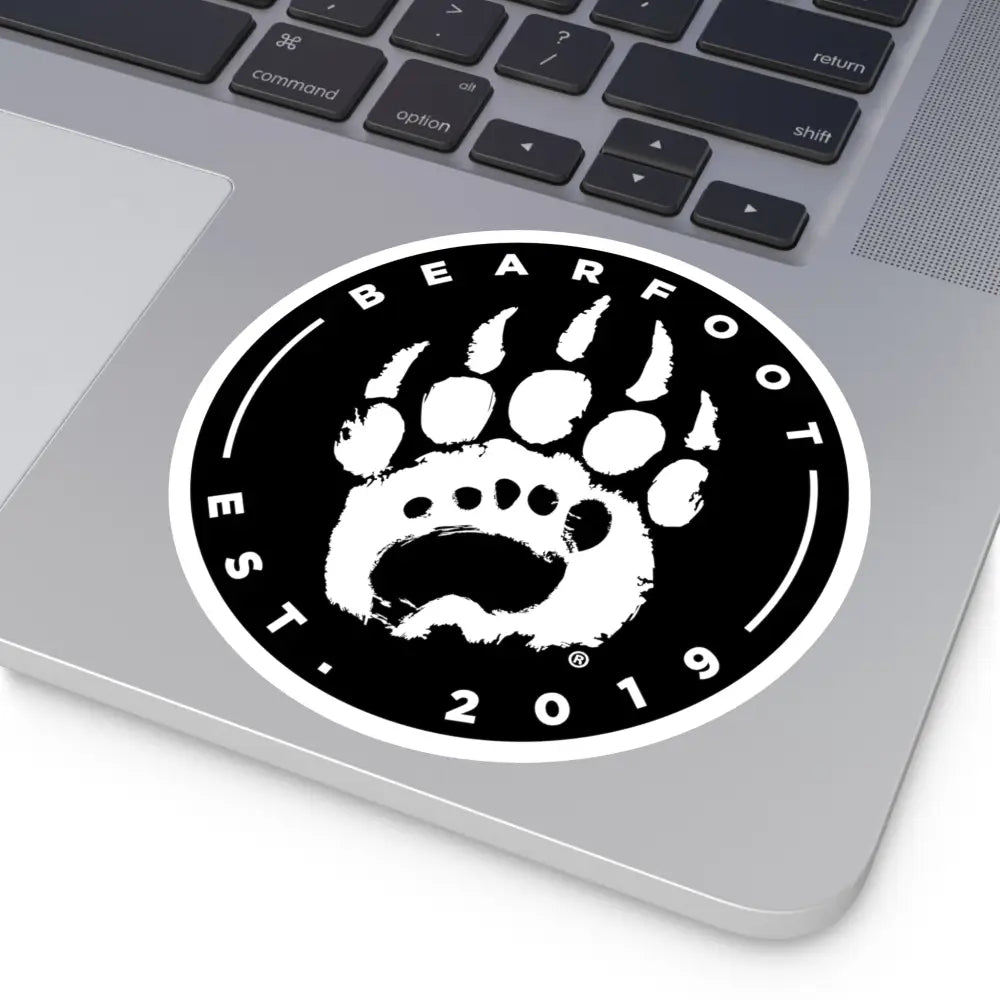 Black and white round stickers with stylized bear paw print and bearfoot text featuring protective laminate