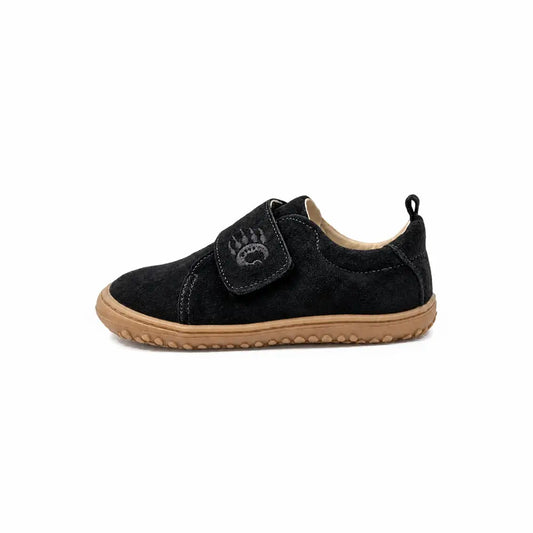 Ursa black gum toddler sneaker in suede with tan rubber sole and velcro strap featuring paw print minimalist footwear