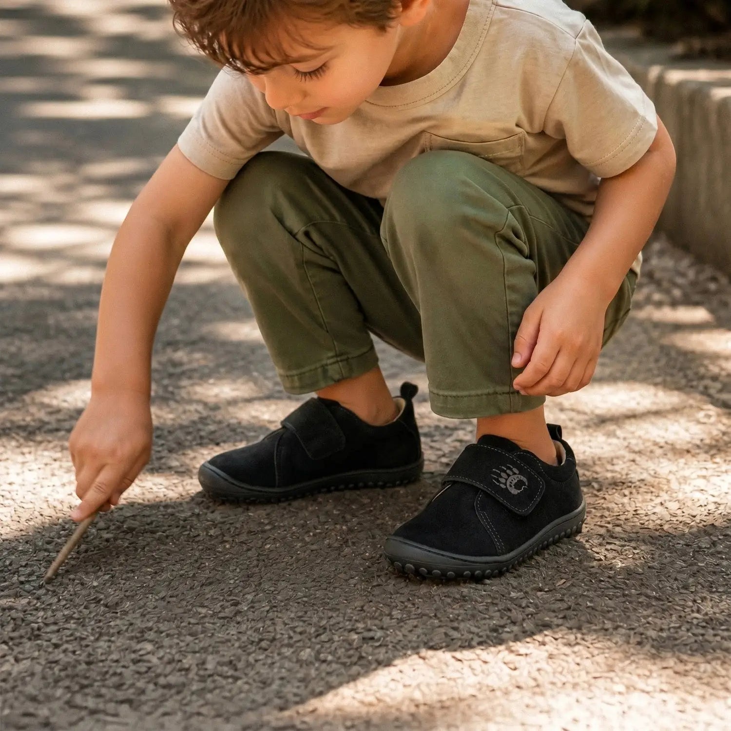 Black velcro fastening children shoes ursa black with wide toe box and subtle logo on the strap