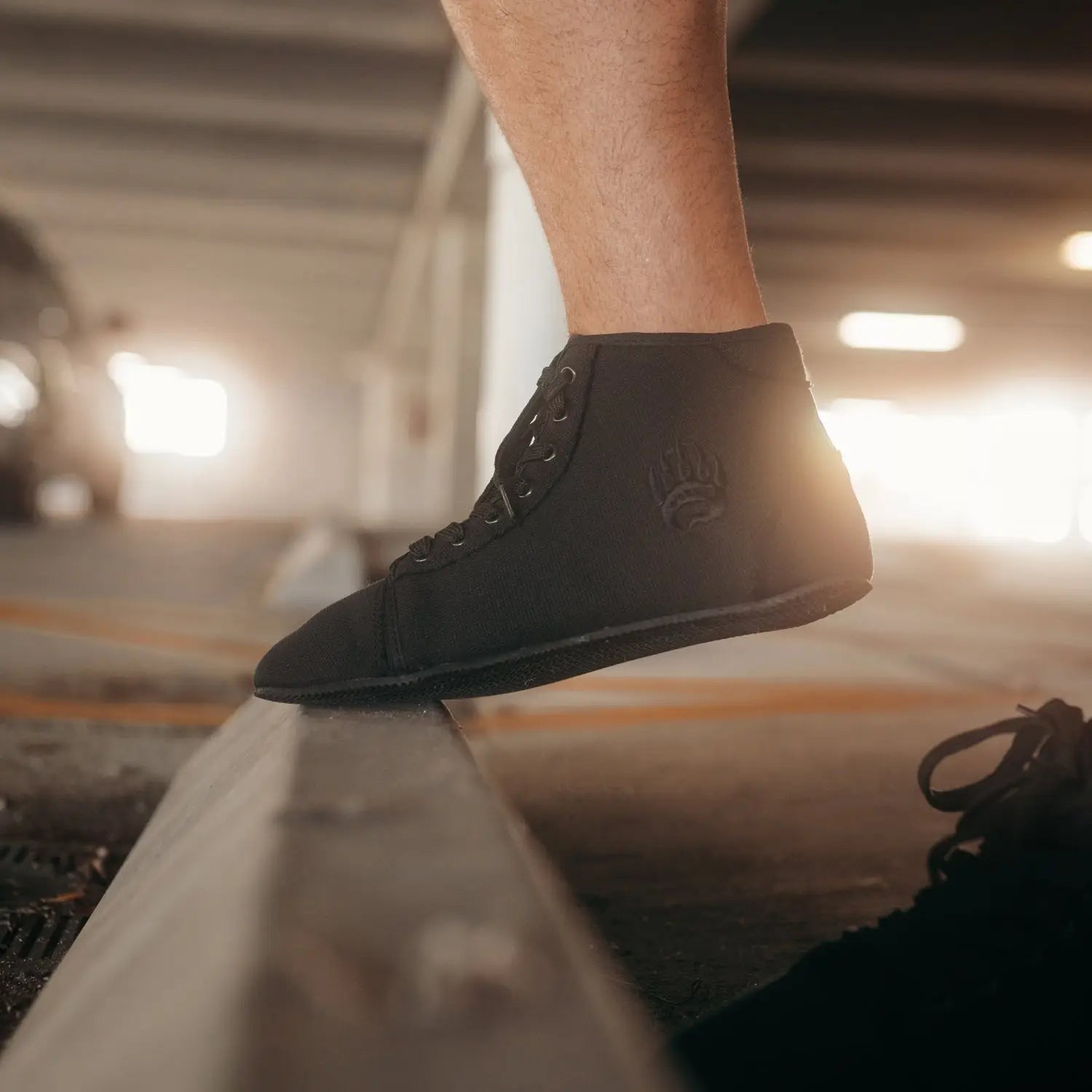 Black ursus chtg1 high-top sneaker with wide toe-box and embossed logo designed for natural foot function