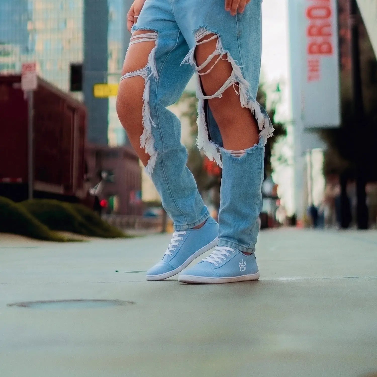 Light blue canvas ursus cltg2 barefoot sneaker with white laces and paw print logo in sky blue color