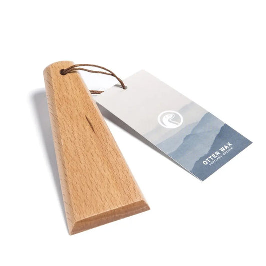 Wooden wax smoothing tool with natural finish and leather loop
